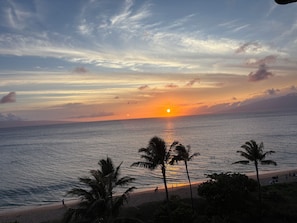 A beach with palm trees and a sunset over the ocean. - Deluxe Oceanfront 2 Bdrm Lockoff at Westin Kaanapali Ocean Resort Villas South (Lahaina)