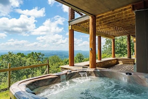 A hot tub with a wooden deck and a view of mountains. - Cloud Top Lodge - Escape to a Heavenly View (Murphy)