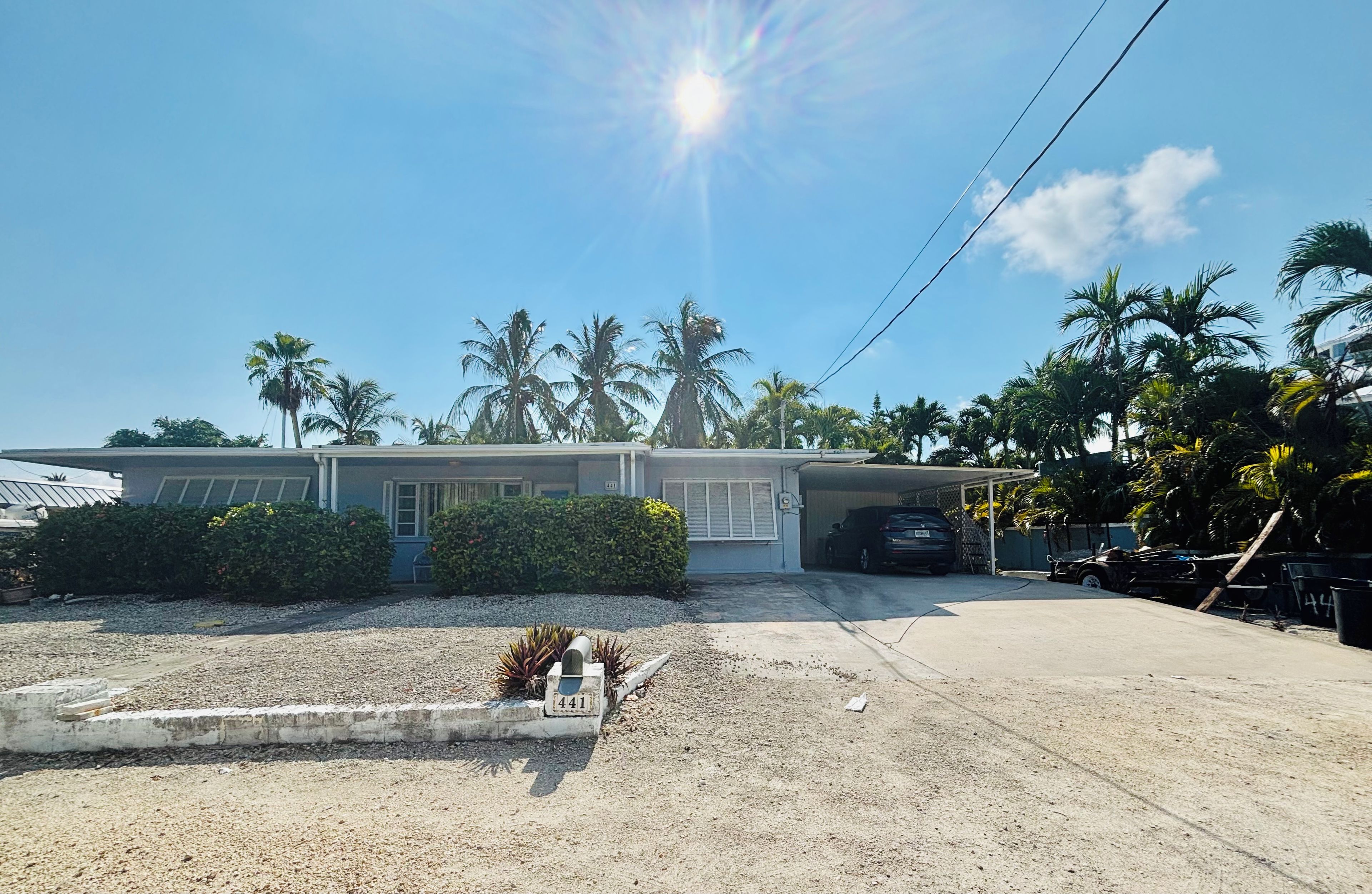 A residential property with a garage, a driveway, and a well-maintained lawn.