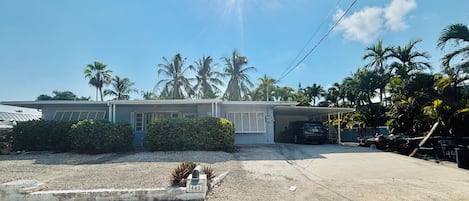 A residential property with a garage, a driveway, and a well-maintained lawn.