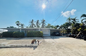 A residential property with a garage, a driveway, and a well-maintained lawn.