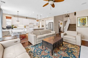 A modern living room with a sofa, coffee table, and a patterned rug. - 5BR Fallbrook Hideaway | Hot Tub + Scenic Getaways (Fallbrook)