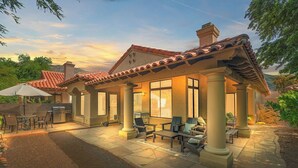 A house with a patio area, outdoor furniture, and a grill. - Newly Renovated Foothills Home at the Base of the Catalina Mountains (Tucson)