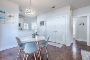 A dining area with a round table, four chairs, and a hanging light fixture. - Spacious 3BR Downstairs Home Near TCU - Fort Worth (Fort Worth)