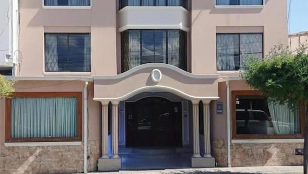 A hotel with a sign reading 'HOTEL ROCIO' above the entrance. - Hotel Rocio (Riobamba)
