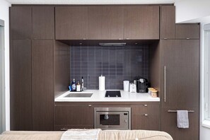 A compact kitchen with a microwave, toaster, and coffee maker. - Executive Yorkville Stay Glam Vanity Mirror (Toronto)