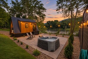 A cozy cabin with a hot tub, outdoor seating, and a scenic lake view. - Juniata River Escape (McVeytown)