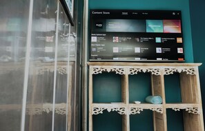 A tablet displaying a content store interface with various app categories. - Wanderlust (Jacó)