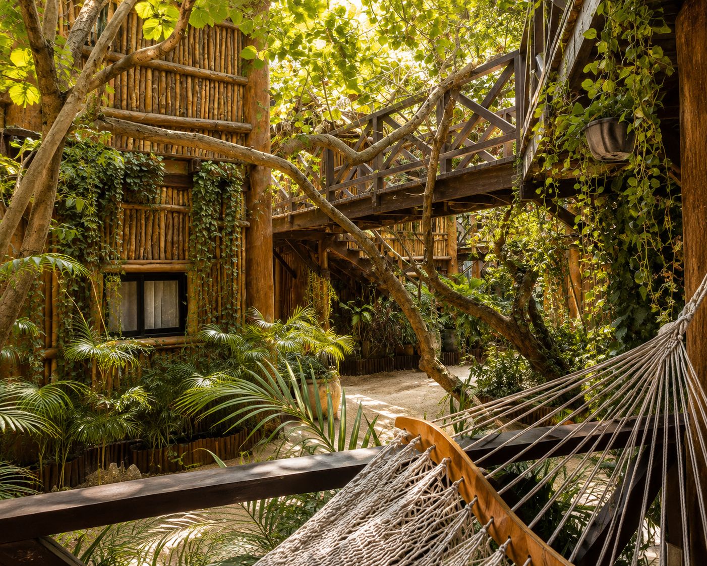 A hammock in a lush garden with a wooden structure and dense foliage.