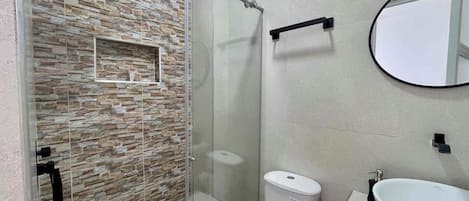 Shower, towels, soap, toilet paper