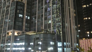 A high-rise building with multiple floors, large windows, and a modern architectural design. - One Uptown Residence BGC
Sky-High BGC Stay | Work & Relax (Makati City)