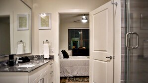 A bathroom with a shower, a toilet, and a sink. - The Luxe Oasis, Resort Pool, Near Grandscape & The Star (Lewisville)