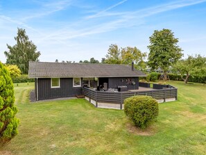A single-story house with a covered patio and a small lawn. - "Efrosina" - 600m from the sea by Interhome (Hejls)