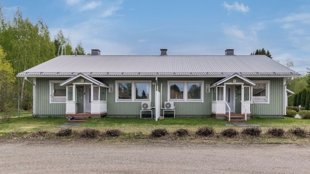 A two-story building with a metal roof, two porches with steps, and a gravel driveway. - Viinijärvi d 10 by Interhome (Liperi)