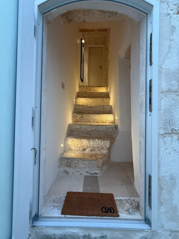 A stone staircase leading to a door with a doormat labeled 'CIAO.' - Terra Mia Double Suite Room with Wi-Fi and Air Conditioning (Carovigno)
