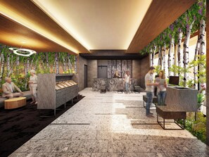 En moderne lobby med reception, siddeområde og receptionsdisk.
