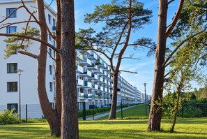 A modern apartment building with a uniform facade and balconies.