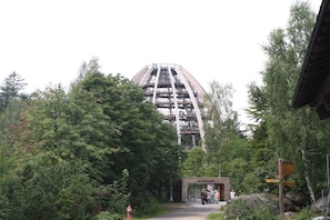 A mountain with a ski lift, surrounded by trees and a small building labeled 'AUSGANG'. - Holiday apartment with 3 bedrooms (Fürsteneck)