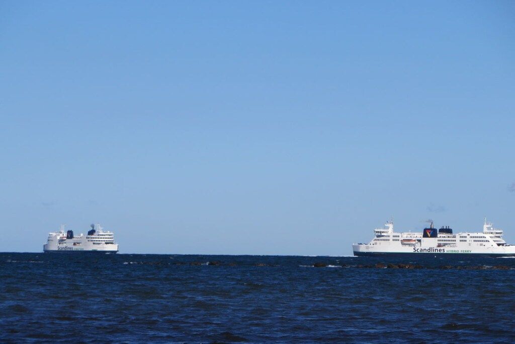 Two large cruise ships on the ocean.