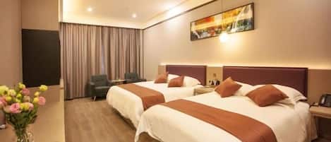 A hotel room with two beds, a desk, a chair, a TV, and a painting on the wall.