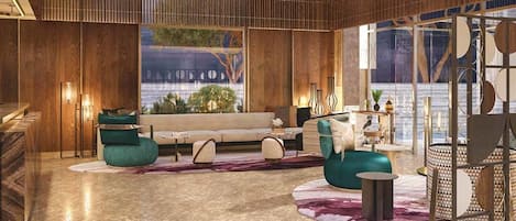 Un interior moderno con sofá, sillas y una lámpara decorativa.