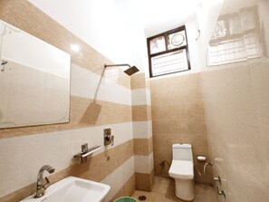A bathroom with a sink, mirror, shower, and toilet. - Premium Rooms For Corporates, Couples, Families, Students And Travelers (Ludhiana)