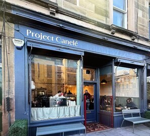 A storefront with a sign reading 'Project Canelé'. - Lovely Victorian Flat in Edinburgh's Historic New Town  (Edinburgh)