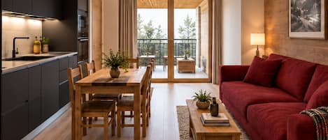A modern apartment with a kitchen, dining area, and living room.