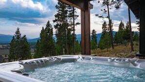 A hot tub with a view of a mountainous landscape and tall pine trees. - 1459 GCR 5221 5 bedroom retreat, 10 private acres, outdoor hot tub, game room (Tabernash)