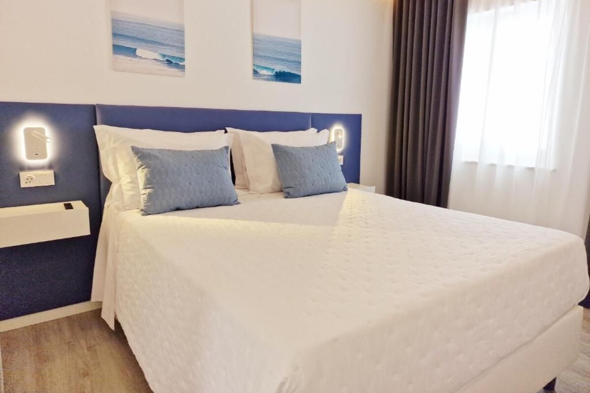 Quarto casal conforto, vista para a cidade | Wi-Fi de cortesia