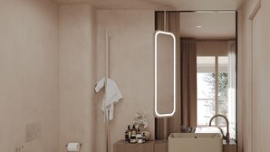 Une salle de bain moderne équipée de toilettes, d’un lavabo et d’une douche.