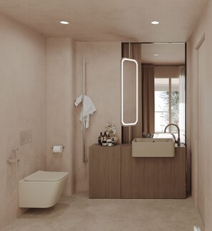 Un baño moderno con inodoro, lavabo y ducha.