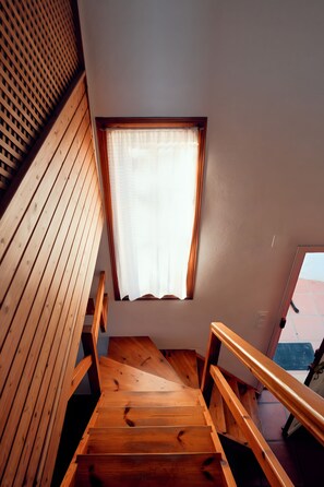 A wooden staircase with a window at the top. - 'La Casita' Country House with Mountain Views. (Vejer de la Frontera)