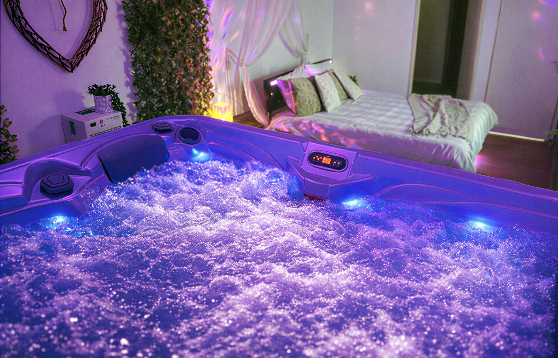 A room with a bed, a wall-mounted plant, and a jacuzzi tub with bubbles.