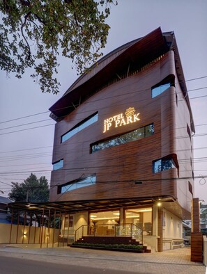 A modern hotel building with a prominent sign reading 'HOTEL JP PARK.' - Hotel JP Park-near Rajagiri Hospital (Aluva)