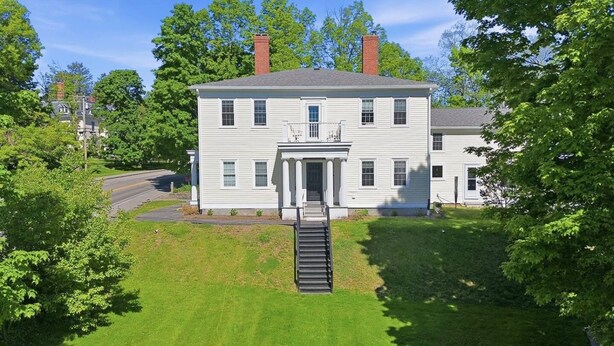 A two-story house with a front porch and a central staircase. - The Federal Flat Steps From Downtown (Belfast)