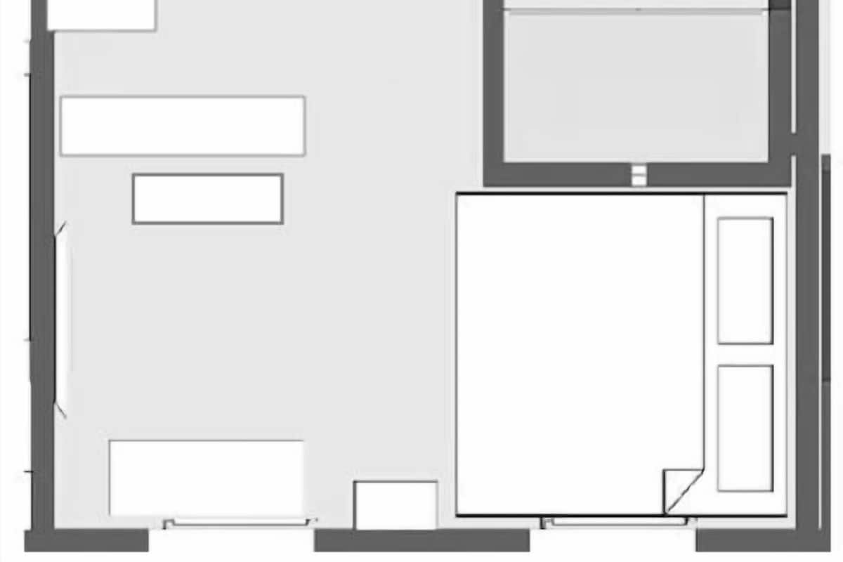 A floor plan with a kitchen, dining area, two bedrooms, a bathroom, and a living room.