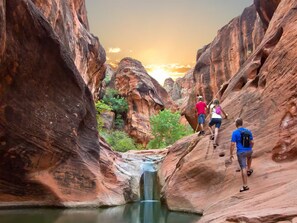 A canyon with hikers ascending a steep rock face. - Huge Private Pool, Hot Tub & BBQ -  Luxury Home w/ Privacy (St. George)