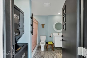 A compact bathroom with a toilet, sink, and a mirror. - Huge Private Pool, Hot Tub & BBQ -  Luxury Home w/ Privacy (St. George)
