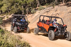 Two off-road vehicles on a dirt path surrounded by trees. - Huge Private Pool, Hot Tub & BBQ -  Luxury Home w/ Privacy (St. George)