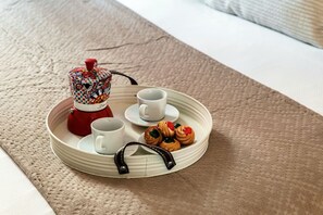 A tray with pastries and cups on a textured surface. - Como In The Sky - 150 steps, by MyHomeInComo (Como)