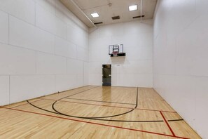 A basketball court with a wooden floor and a basketball hoop. - Vail | Family Ski Escape | Pool + Hot Tub (Vail)
