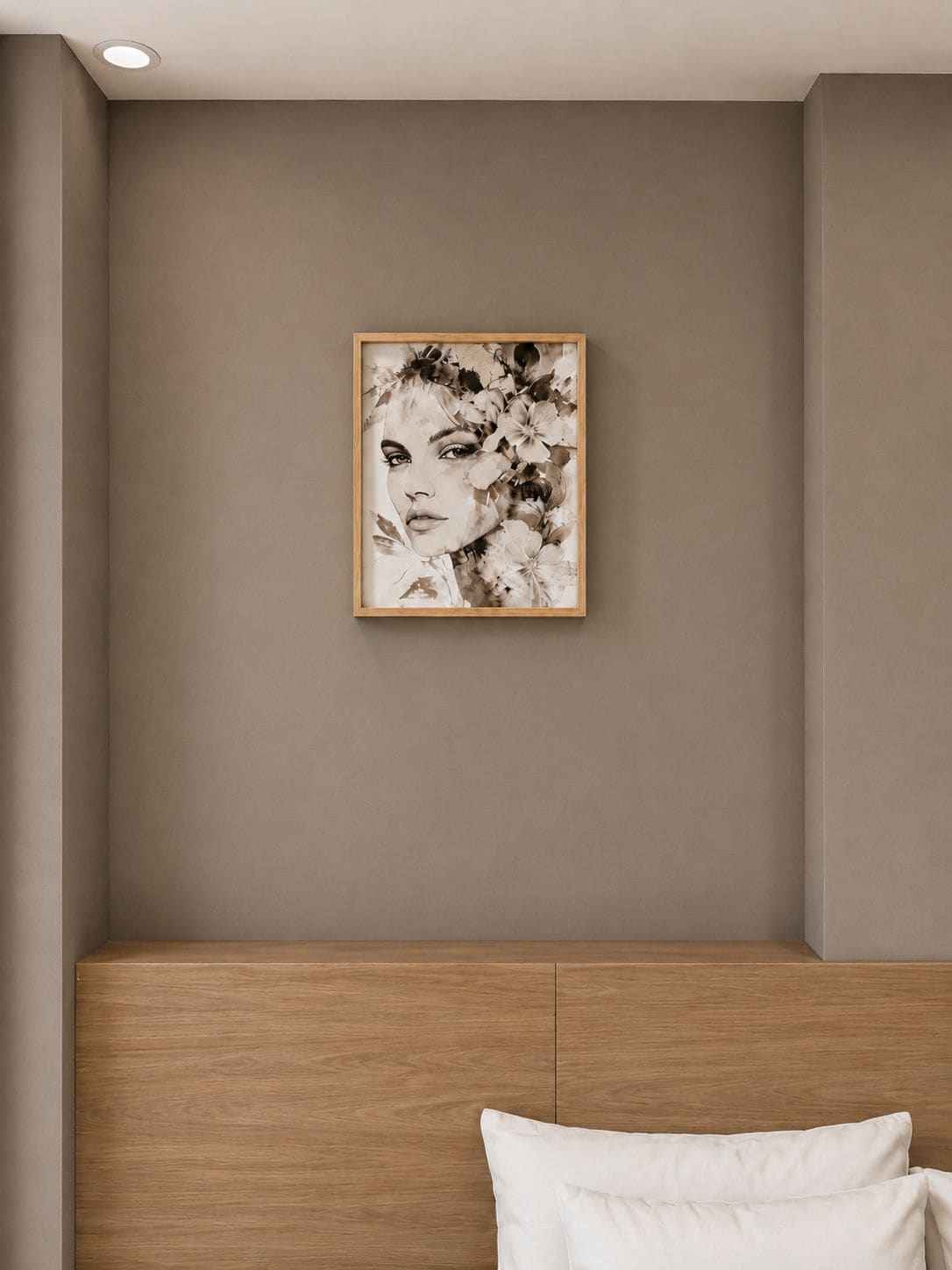 A bedroom with a wooden headboard, a framed artwork on the wall, and a white pillow on the bed.