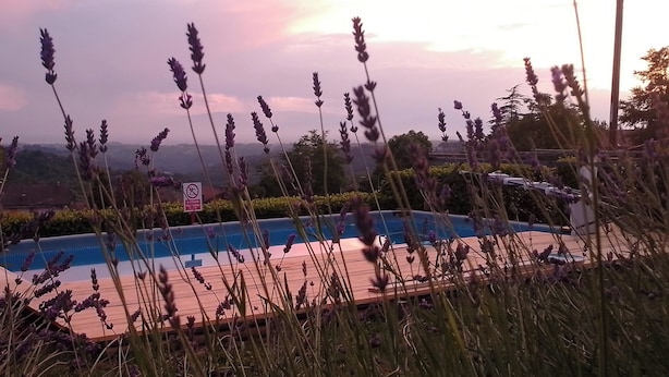 A pool area with a sign indicating no smoking.
