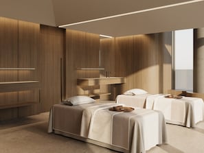 Un dormitorio moderno con dos camas, un tocador empotrado y un ventanal grande.