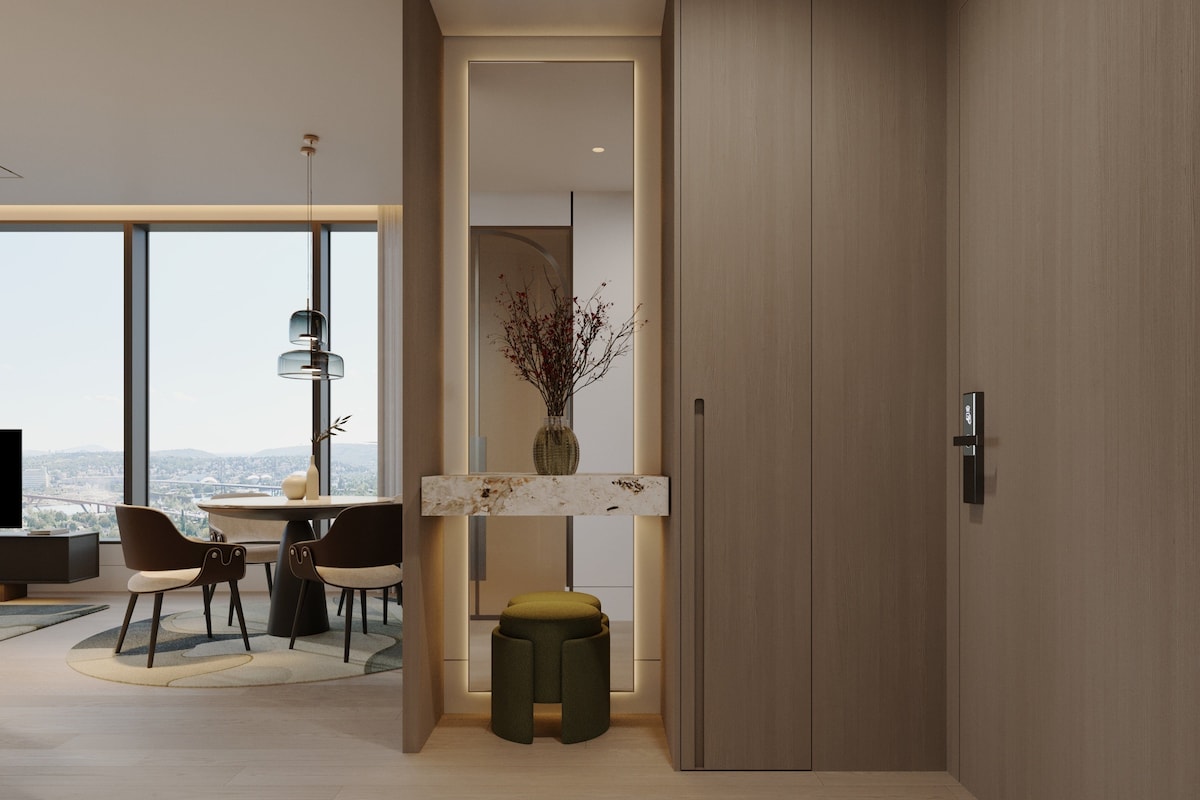 Un interior moderno con comedor, vistas a través de un gran ventanal y un diseño minimalista.