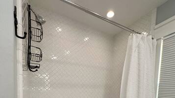 Shower, hair dryer, towels, shampoo