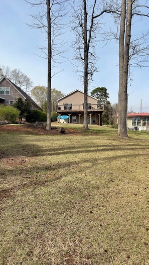 A residential property with a two-story house, a covered patio, and a well-maintained lawn. - Lake Hartwell  Anderson/Townville SC with private dock! Close to Clemson (Townville)