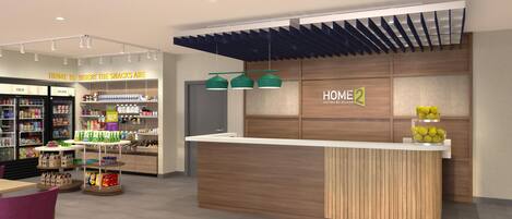 A modern hotel lobby with a reception desk, a snack bar, and a seating area.