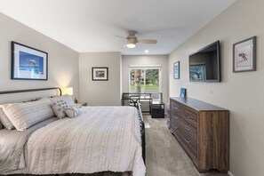 A bedroom with a bed, dresser, desk, and a ceiling fan. - 2BR Condo for 6 w Shared Hot Tub, Near Mtn & Lakes (Mammoth Lakes)